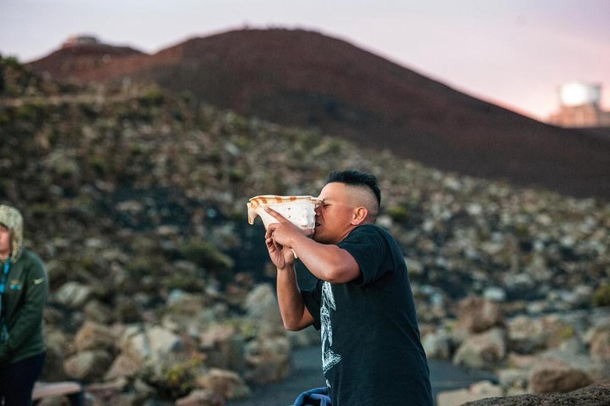 a man is eating a slice of pizza