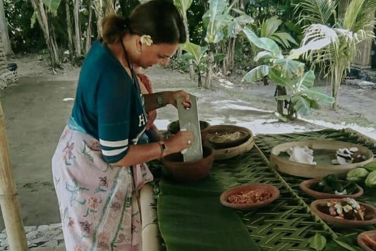 a woman is preparing food on a table