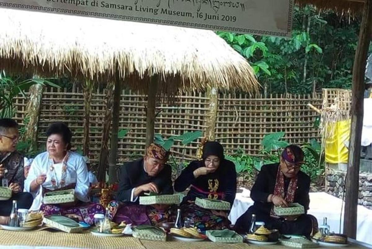 a group of people sitting at a table