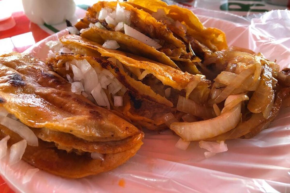 a paper plate with a sandwich and french fries