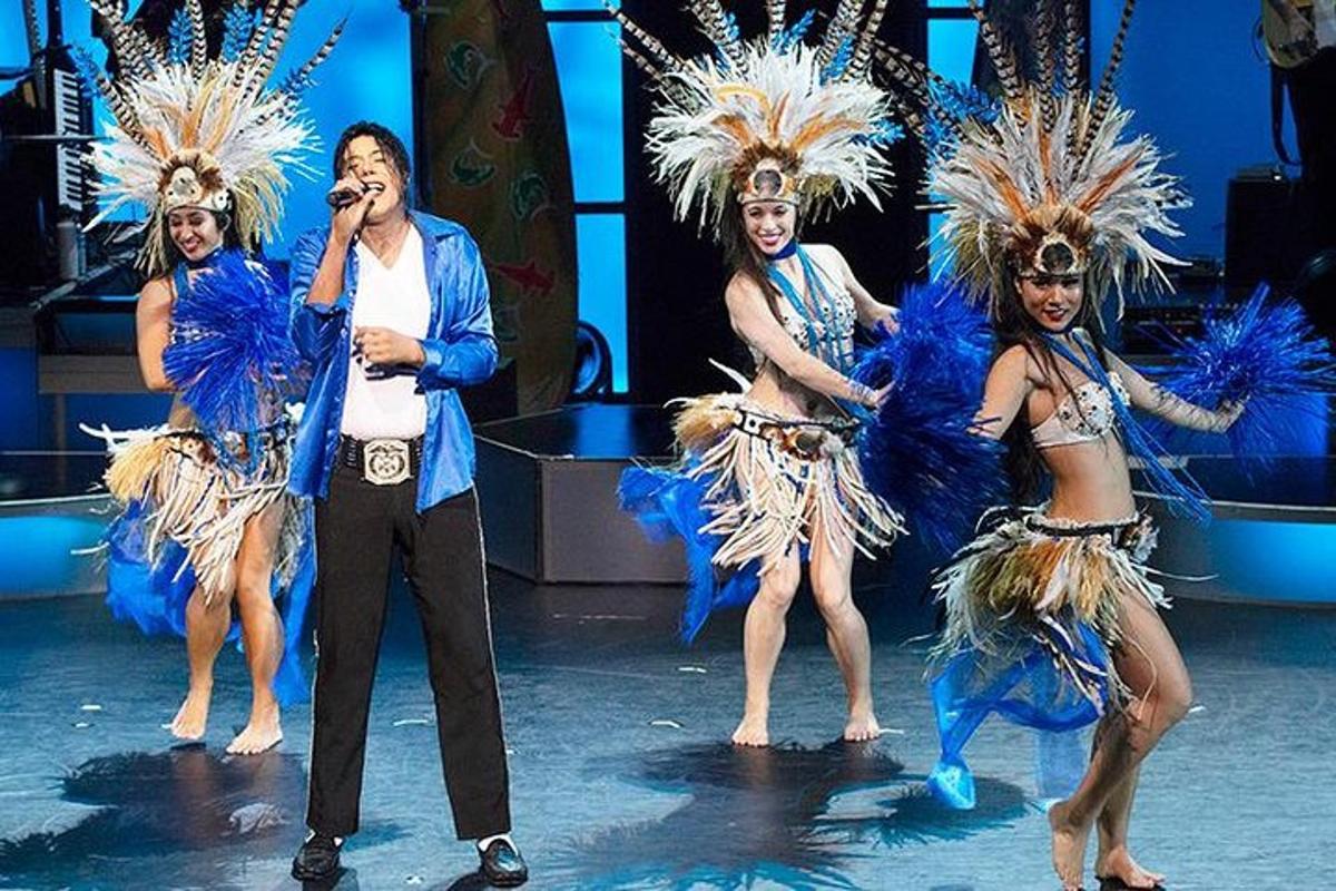 a group of dancers in costumes on a stage
