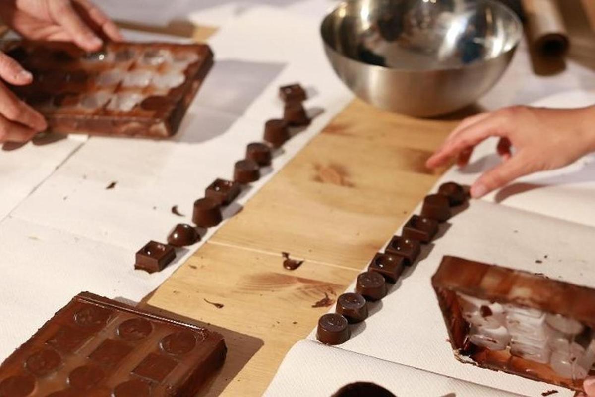 a person is making chocolateuts on a table