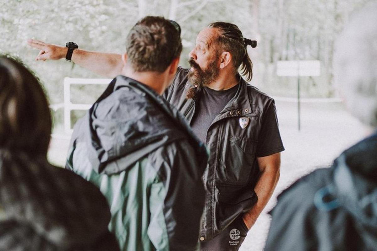a man with a beard talking to another man