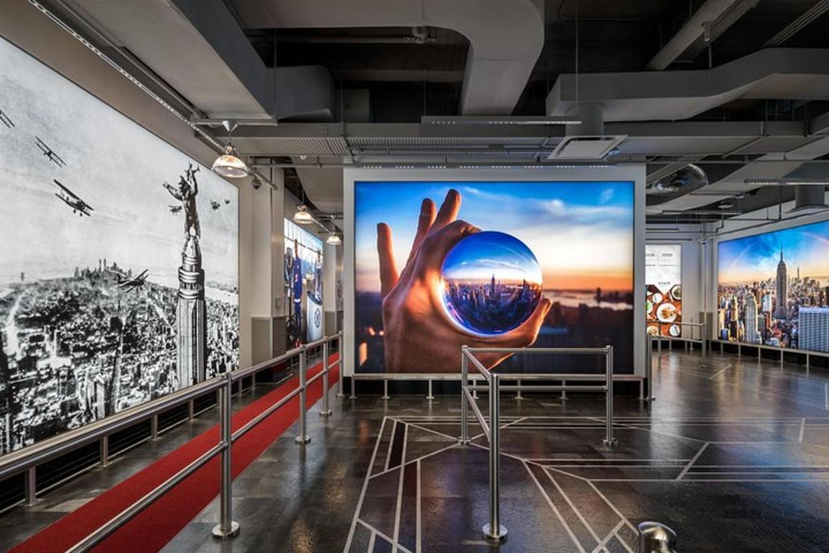 a large billboard in a building with a picture of a hand