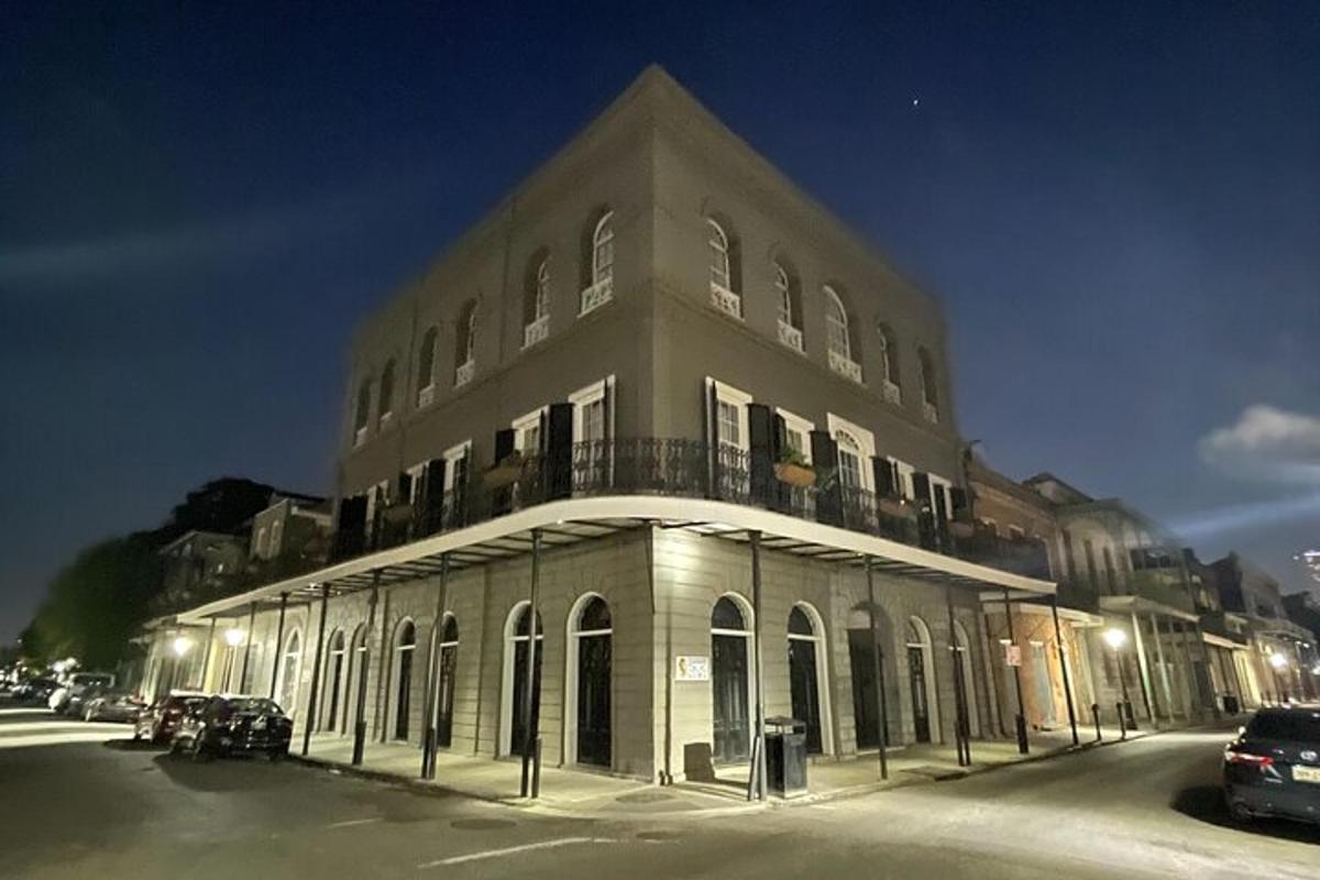 a large building on a street at night
