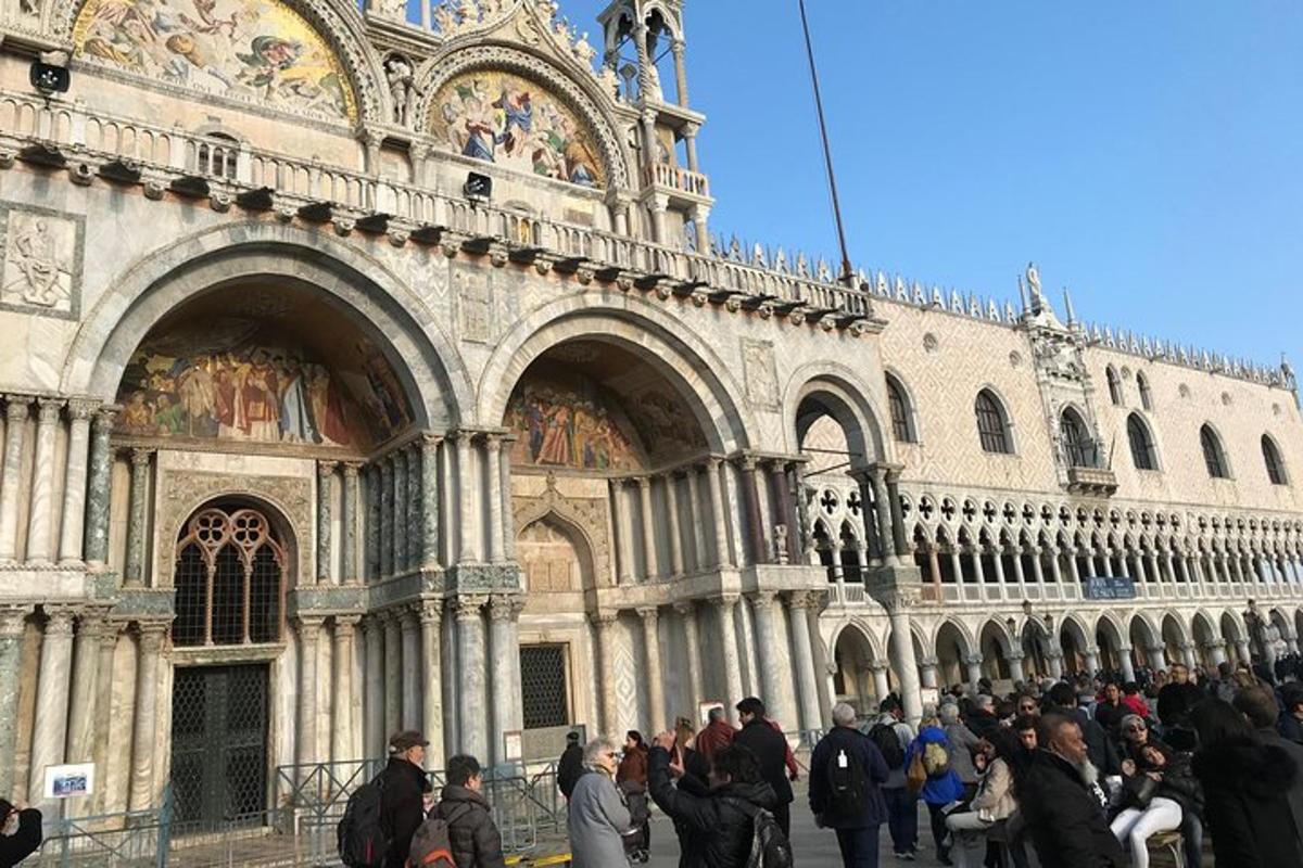 a crowd of people standing outside of a building