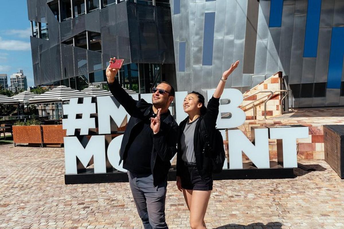 a man and a woman standing in front of a building
