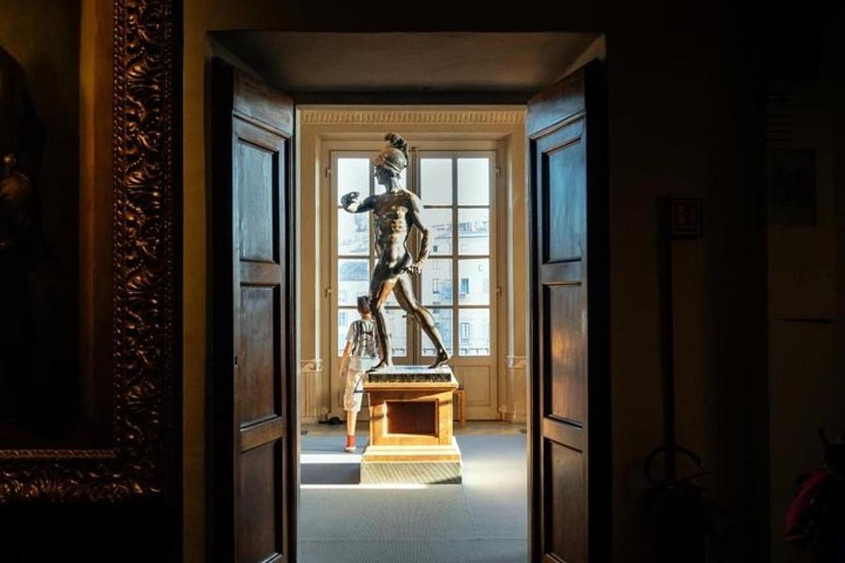 a statue of a woman on a stand in a hallway