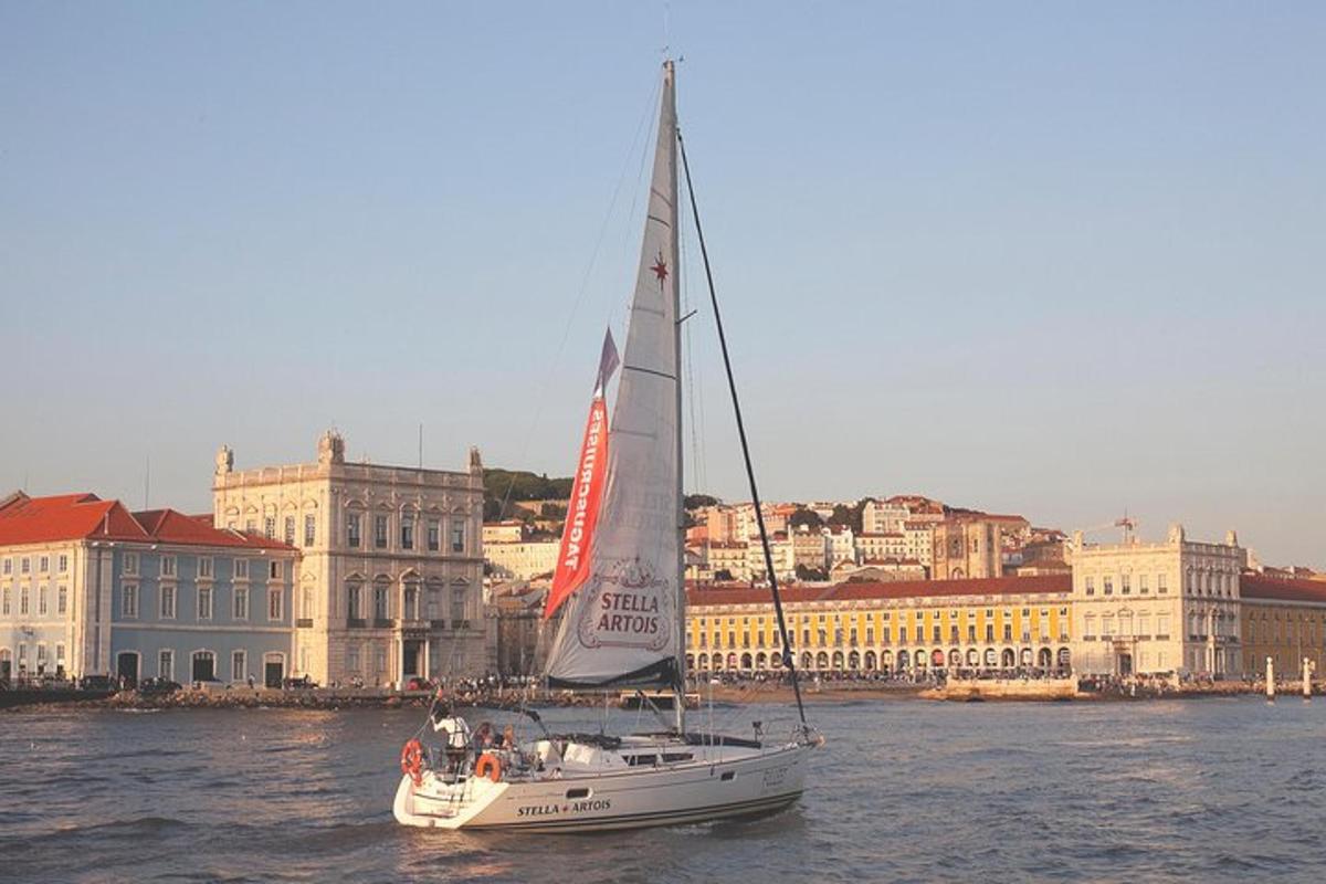 a sailboat in the water in front of a city