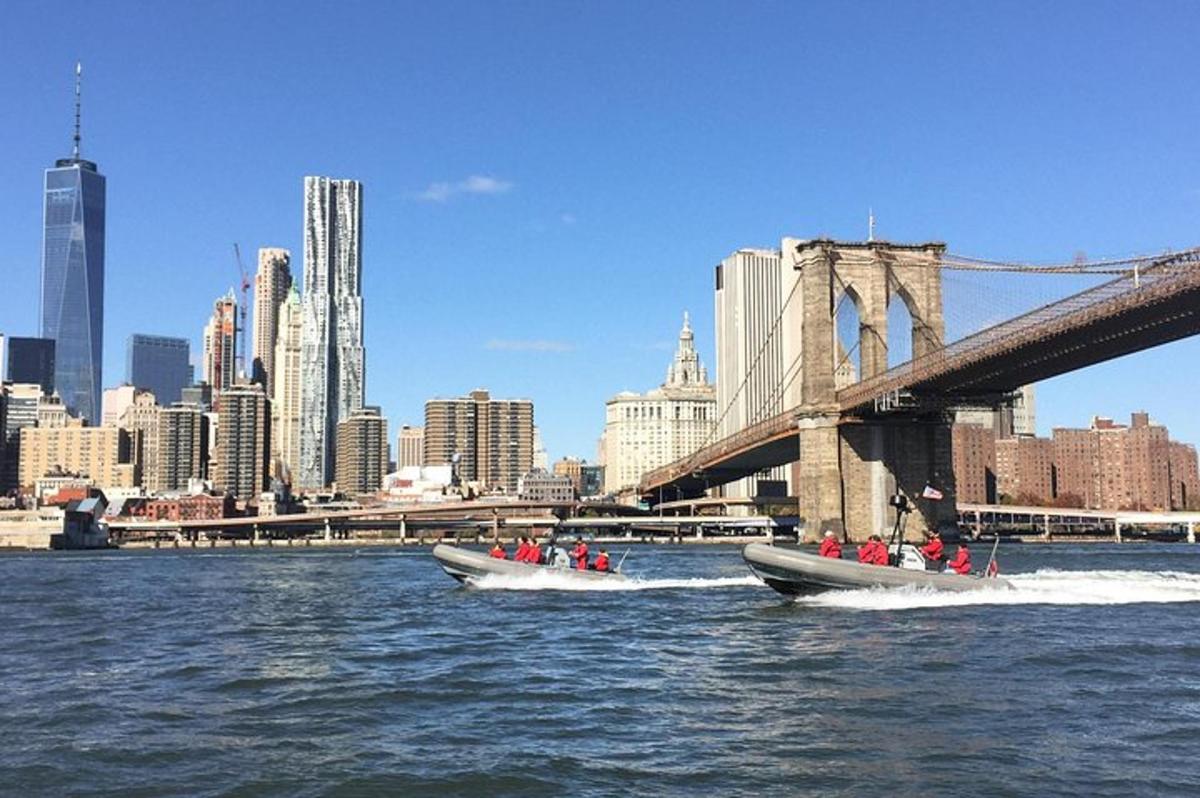 two boats in the water in front of a bridge