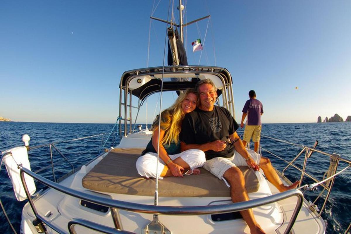 a man and woman sitting on a boat in the water