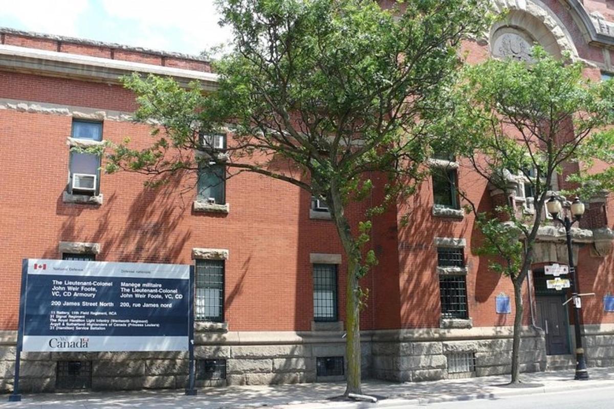 a brick building with a sign in front of it