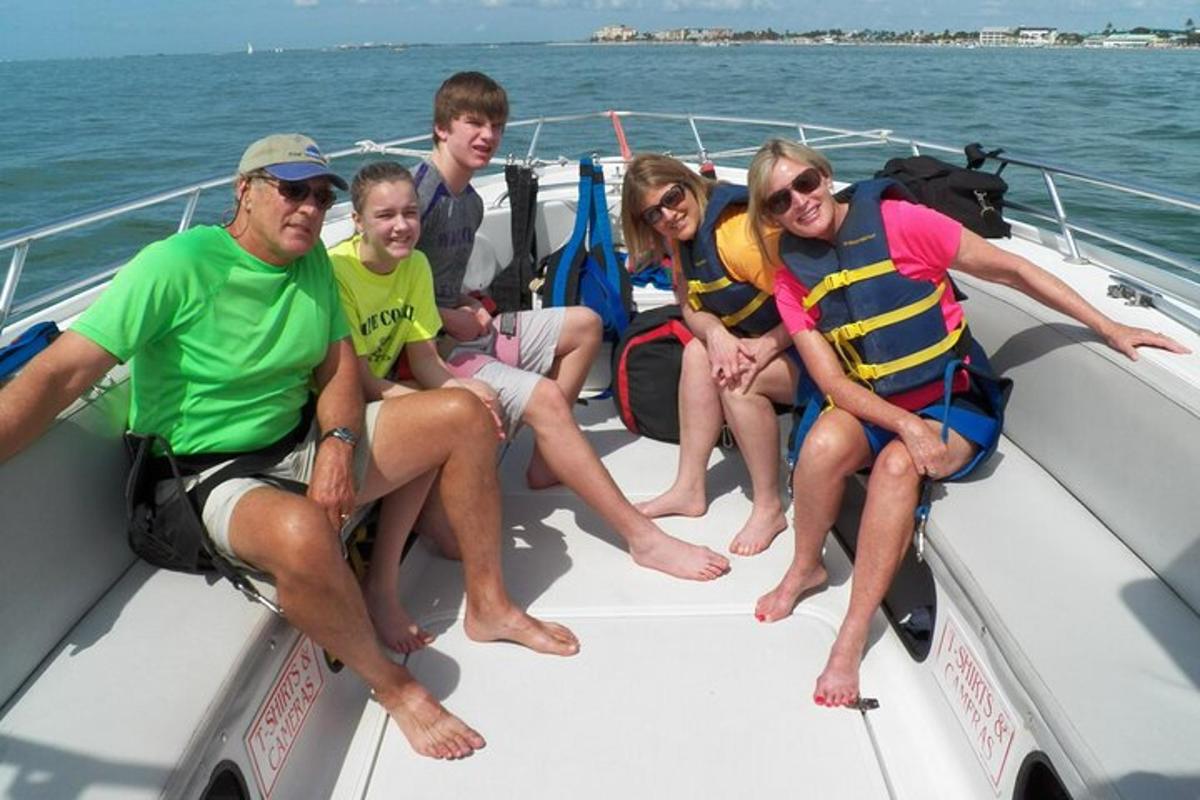 a group of people sitting on a boat