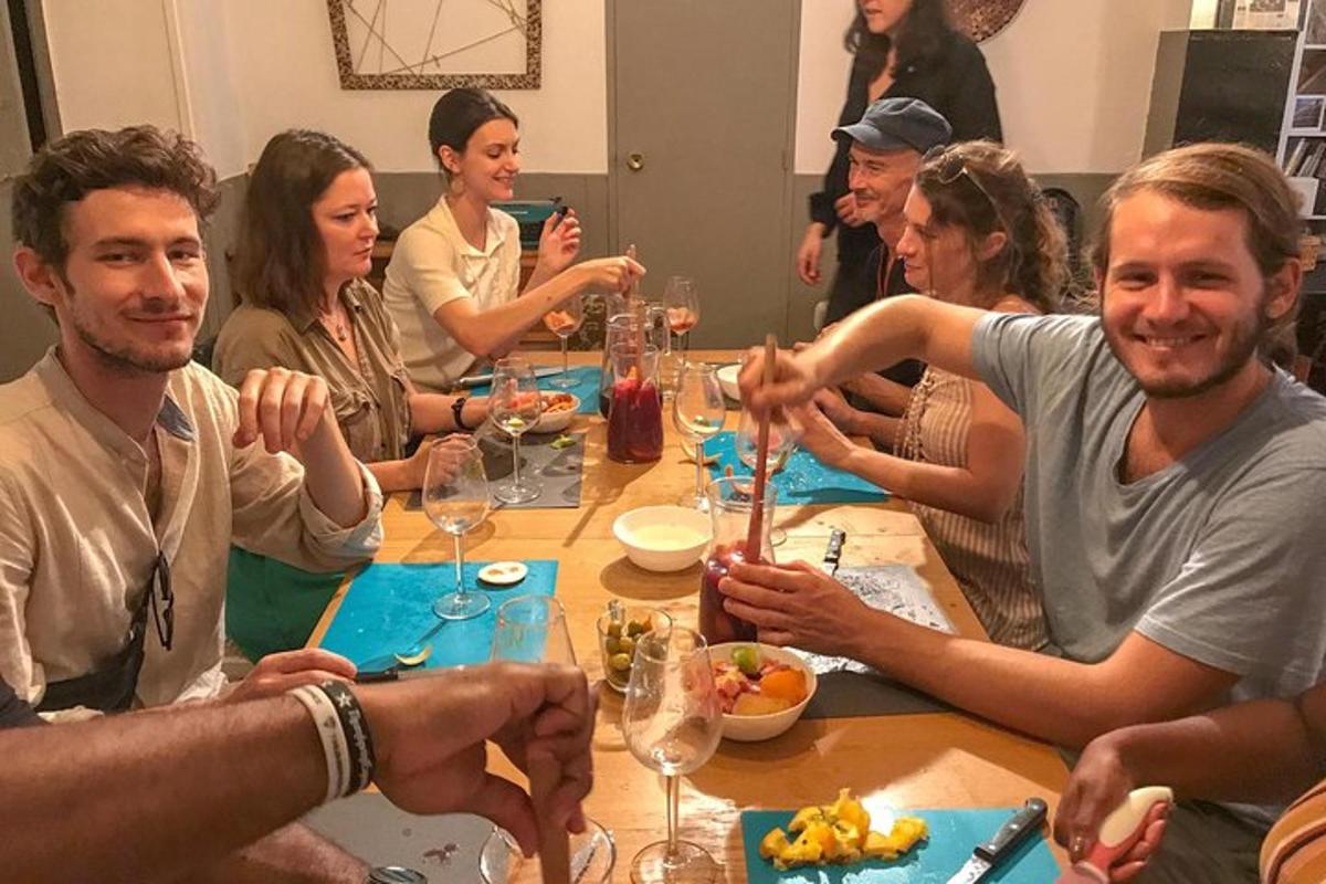 a group of people sitting around a table eating