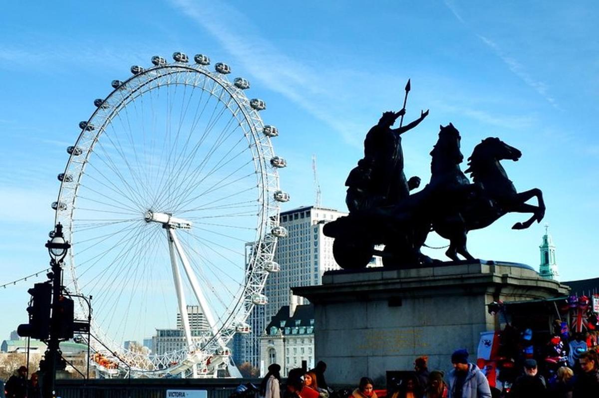 a ferris wheel and a statue of a man on horses
