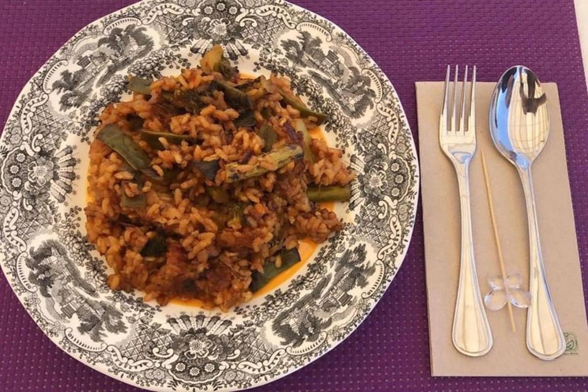 a plate of rice and vegetables on a purple table