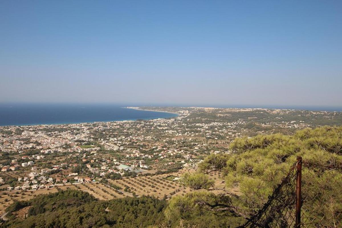 an aerial view of a city and the ocean