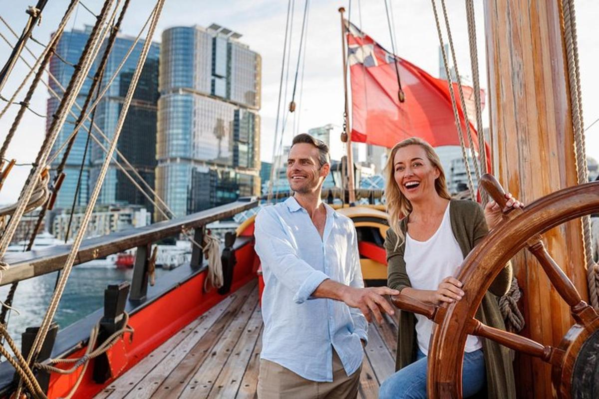 a man and a woman standing on a boat