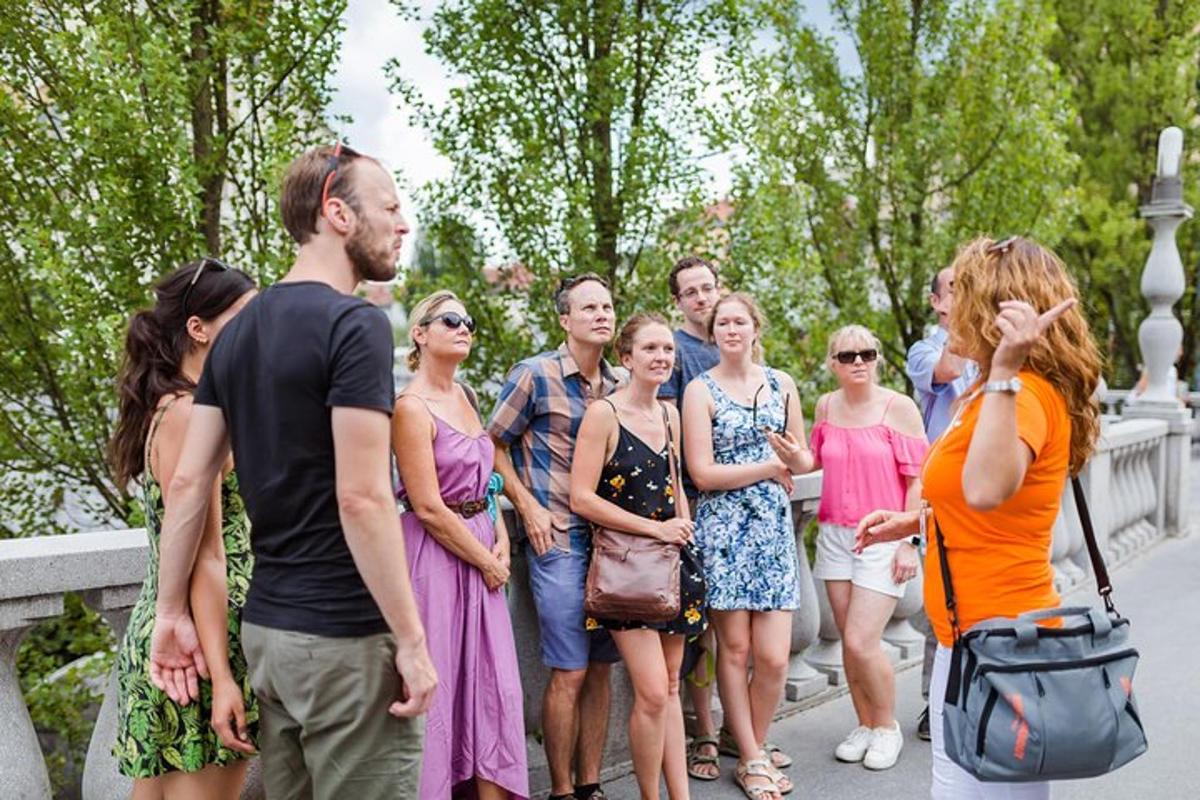 a group of people standing on a bridge
