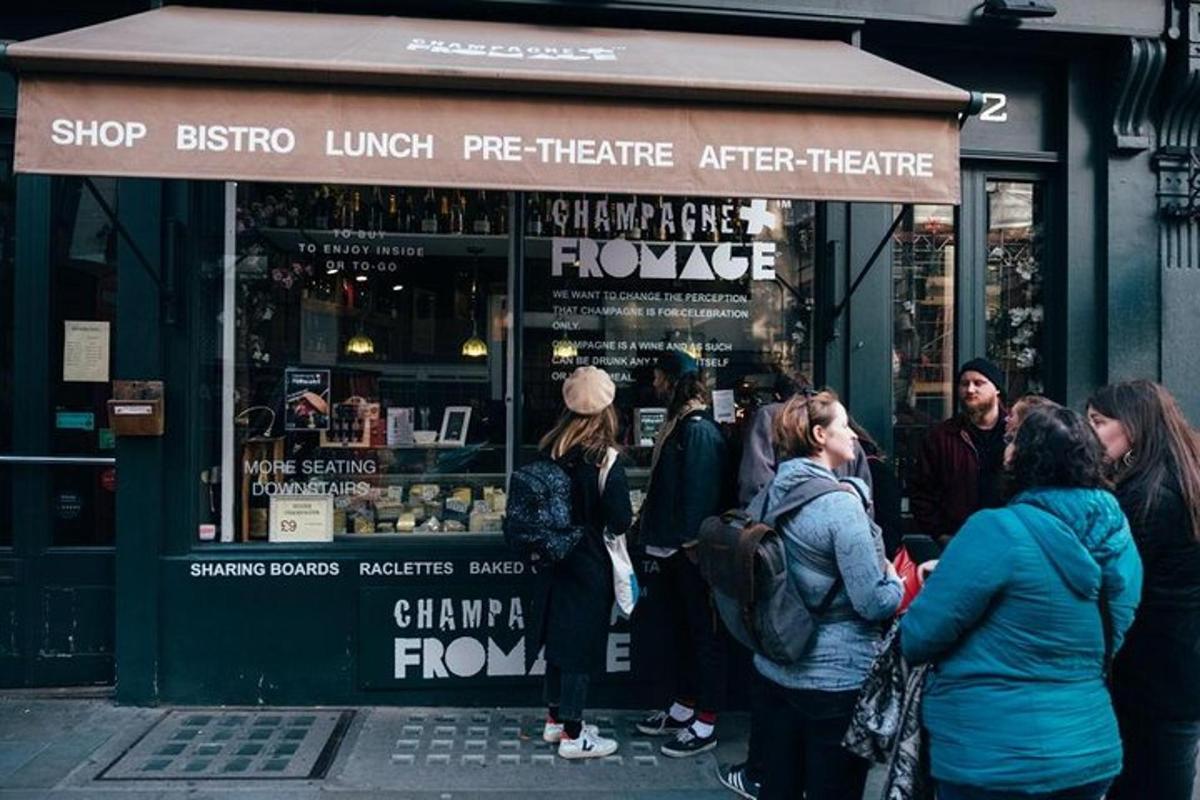 a group of people standing outside of a shop