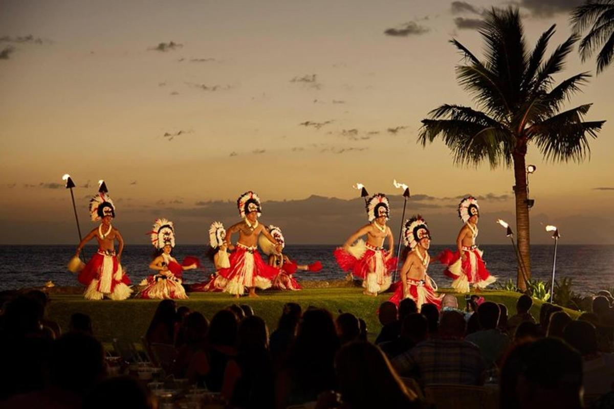 a group of people performing a performance on the beach