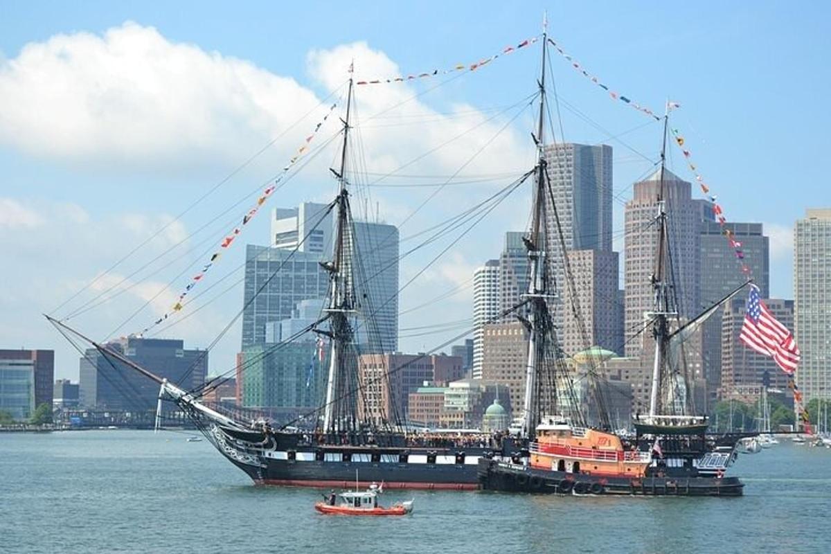 a large pirate ship in the water in a city