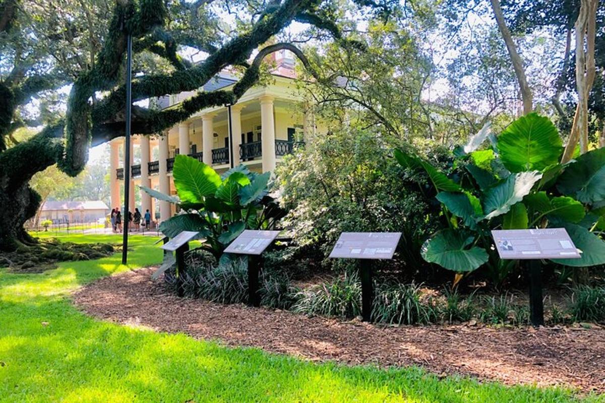 a group of benches in front of a yellow house