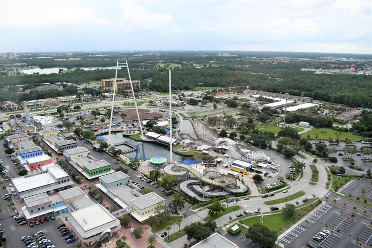 an aerial view of a city with a parking lot