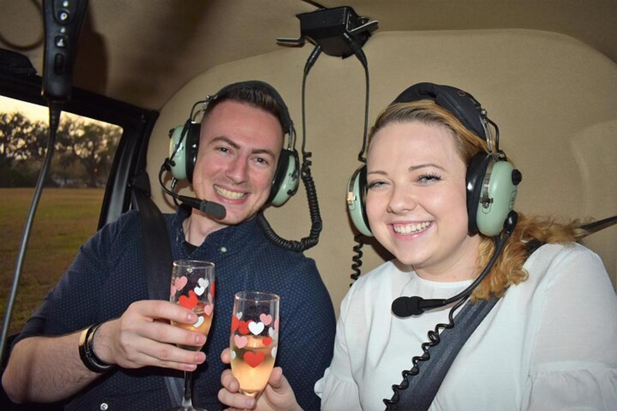 a man and a woman wearing headphones and holding wine glasses