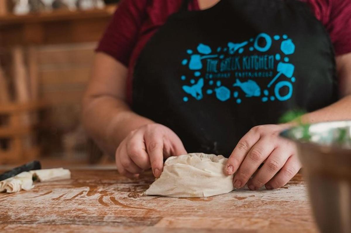 a person kneading a piece of dough on a table