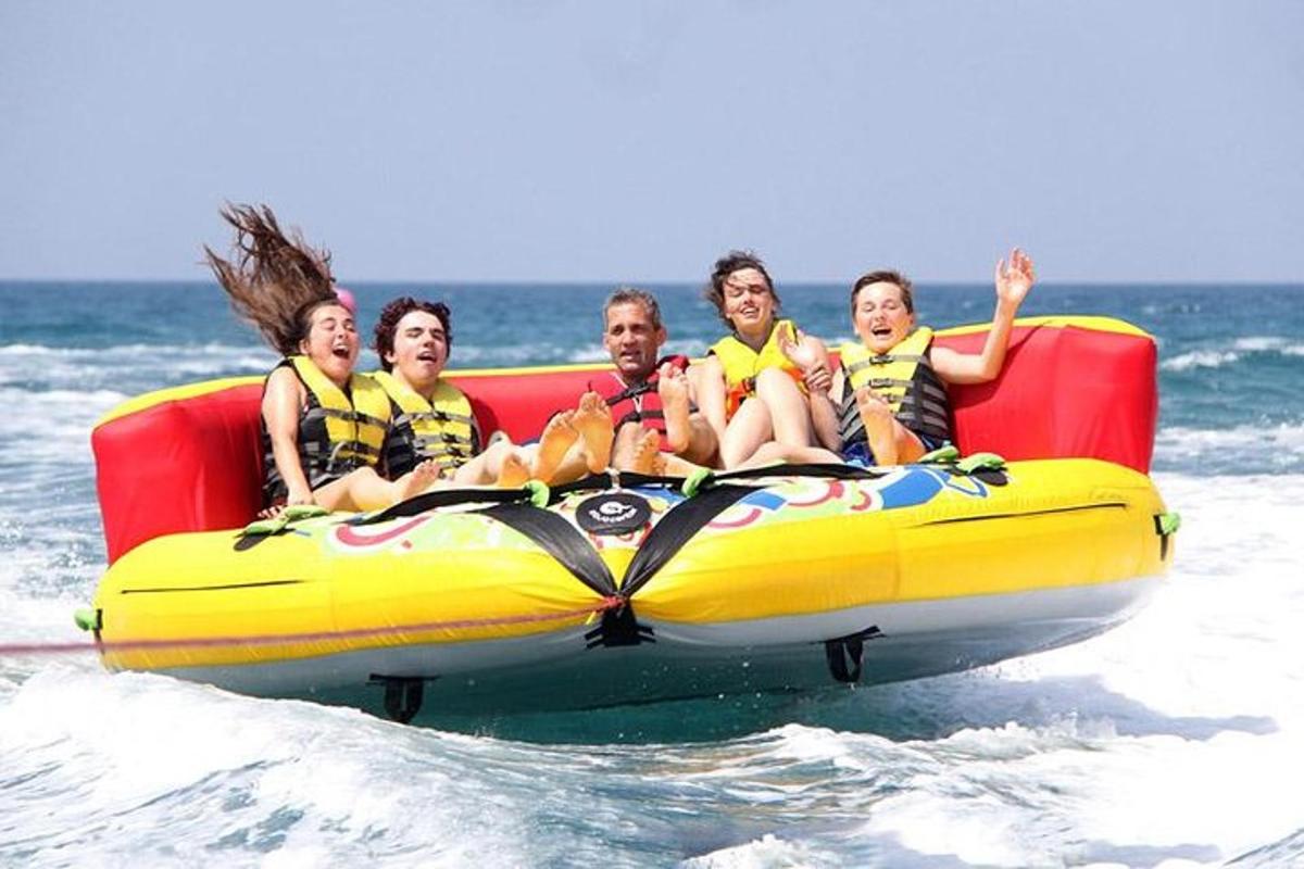 a group of people riding on a raft in the water