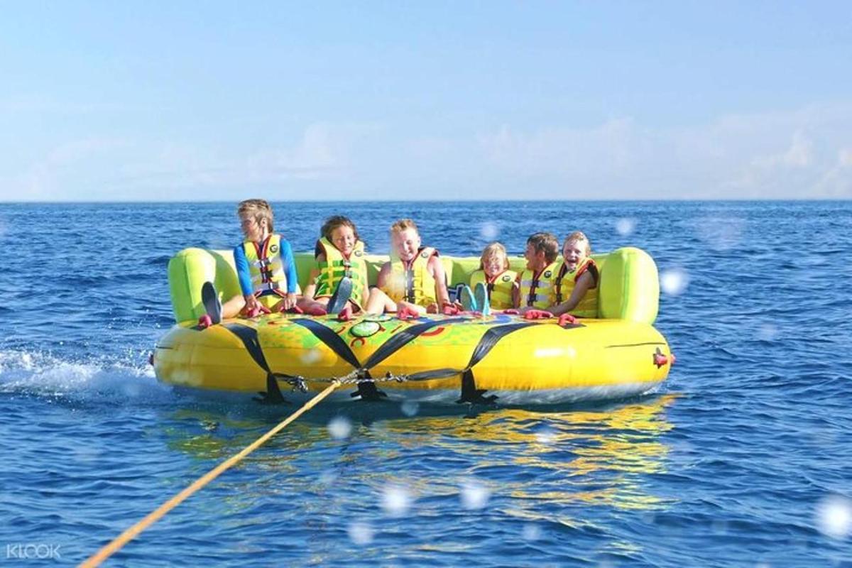 a group of people on a raft in the water
