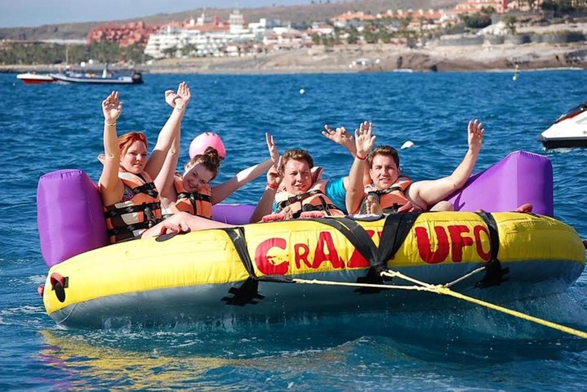 a group of children on a raft in the water