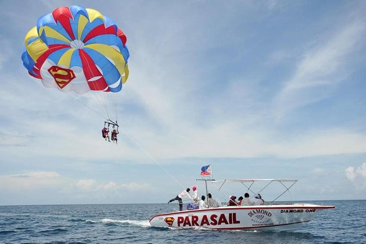 a group of people on a boat with a parachute