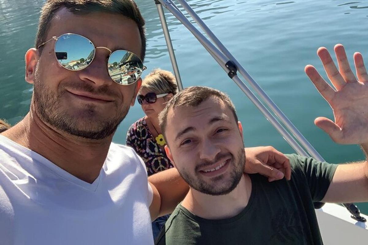 two men on a boat in the water