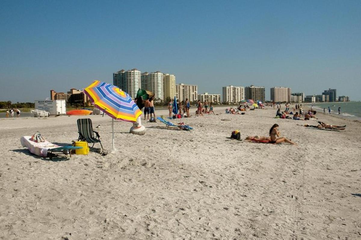a group of people laying on the beach