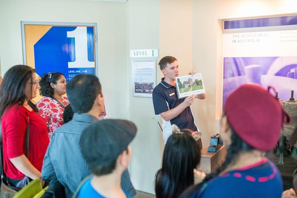 a man standing in a room with a group of people
