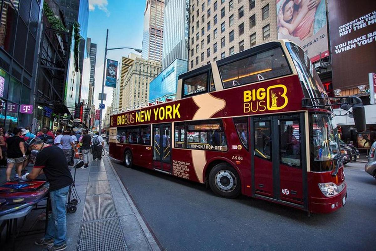 a red double decker bus on a city street