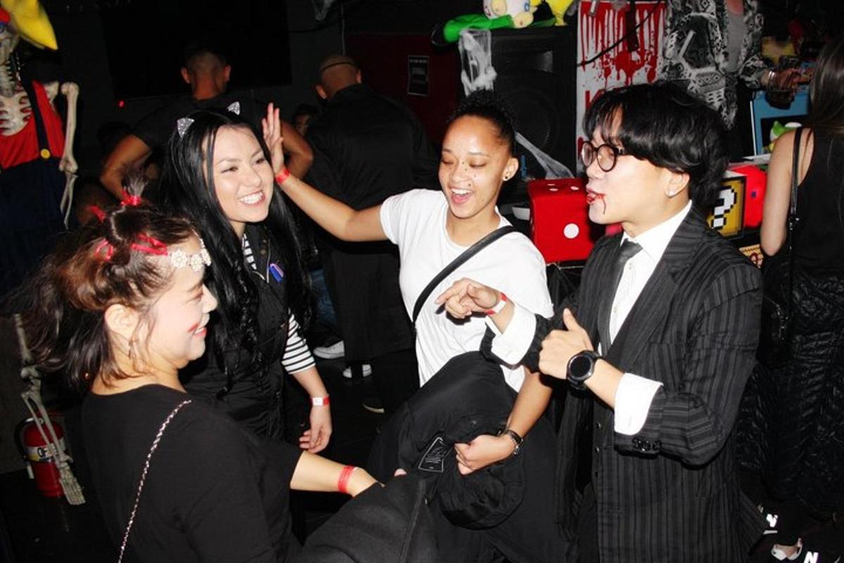 a group of people standing around at a party