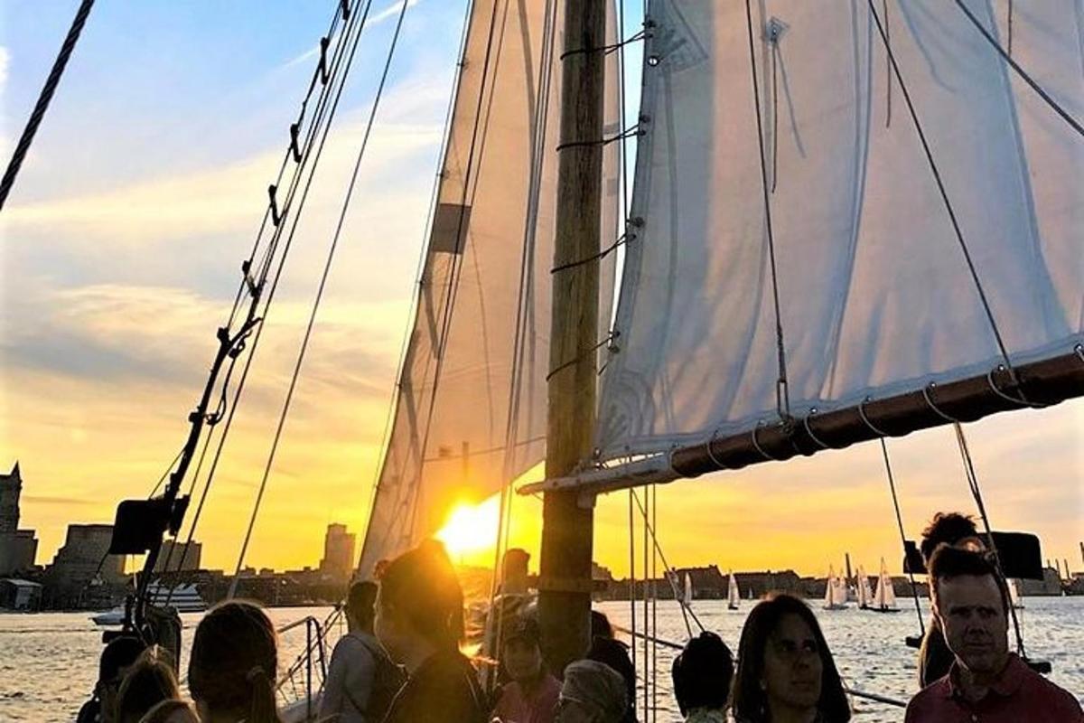 a group of people on a sail boat in the water