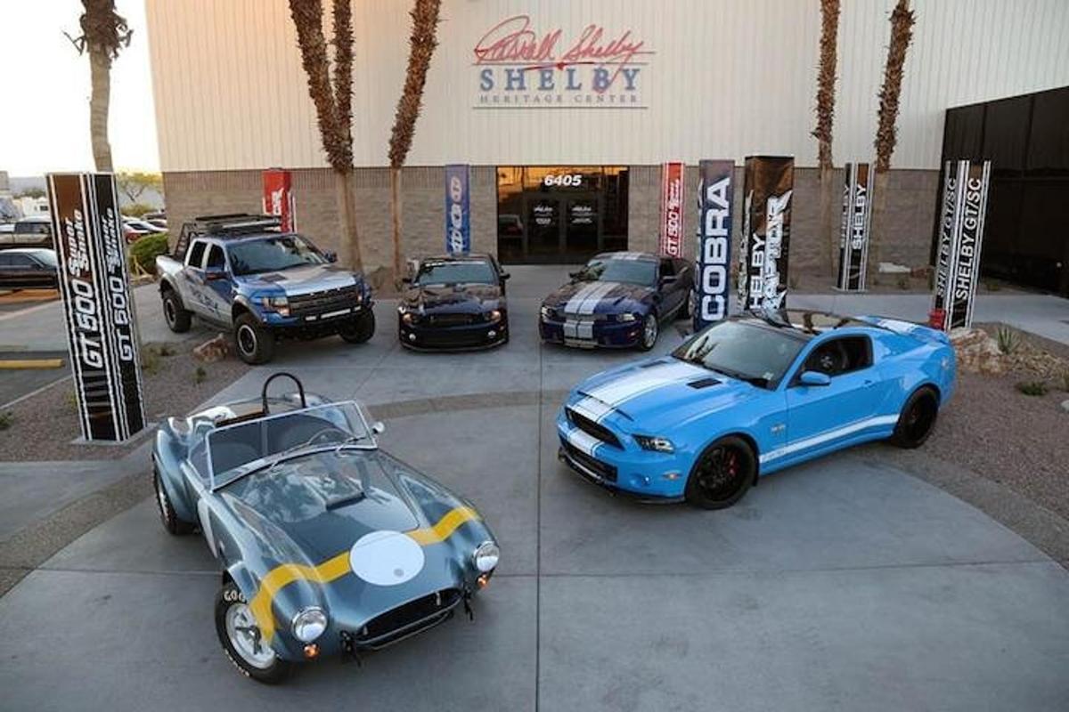 a group of cars parked in front of a building