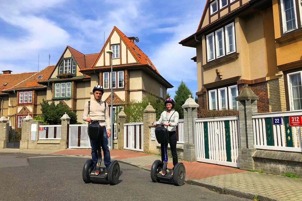 two women riding segways down a street