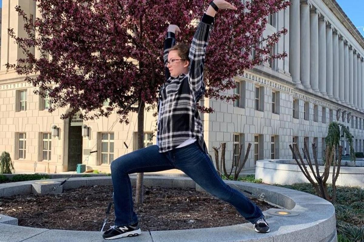 a man is doing a handstand in front of a building