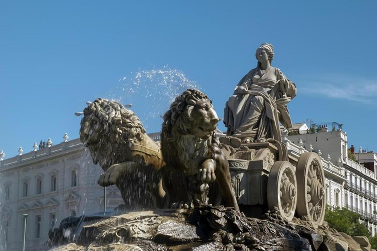 a statue of two lions in front of a building