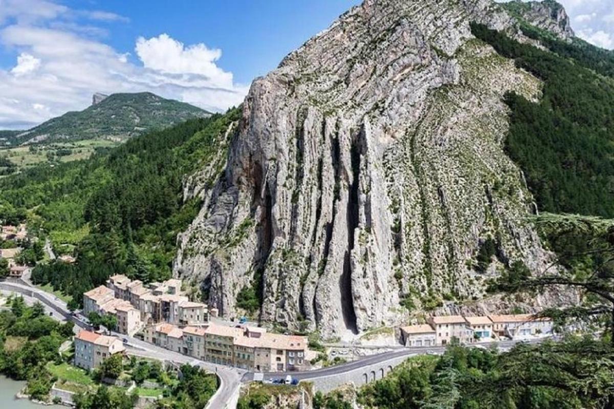 a mountain with a town and a road on it