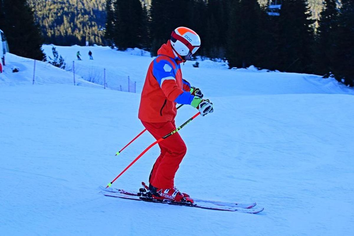 a person is skiing down a snow covered slope