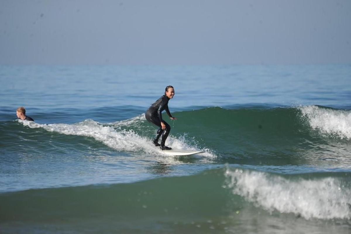 a man riding a wave on a surfboard in the ocean