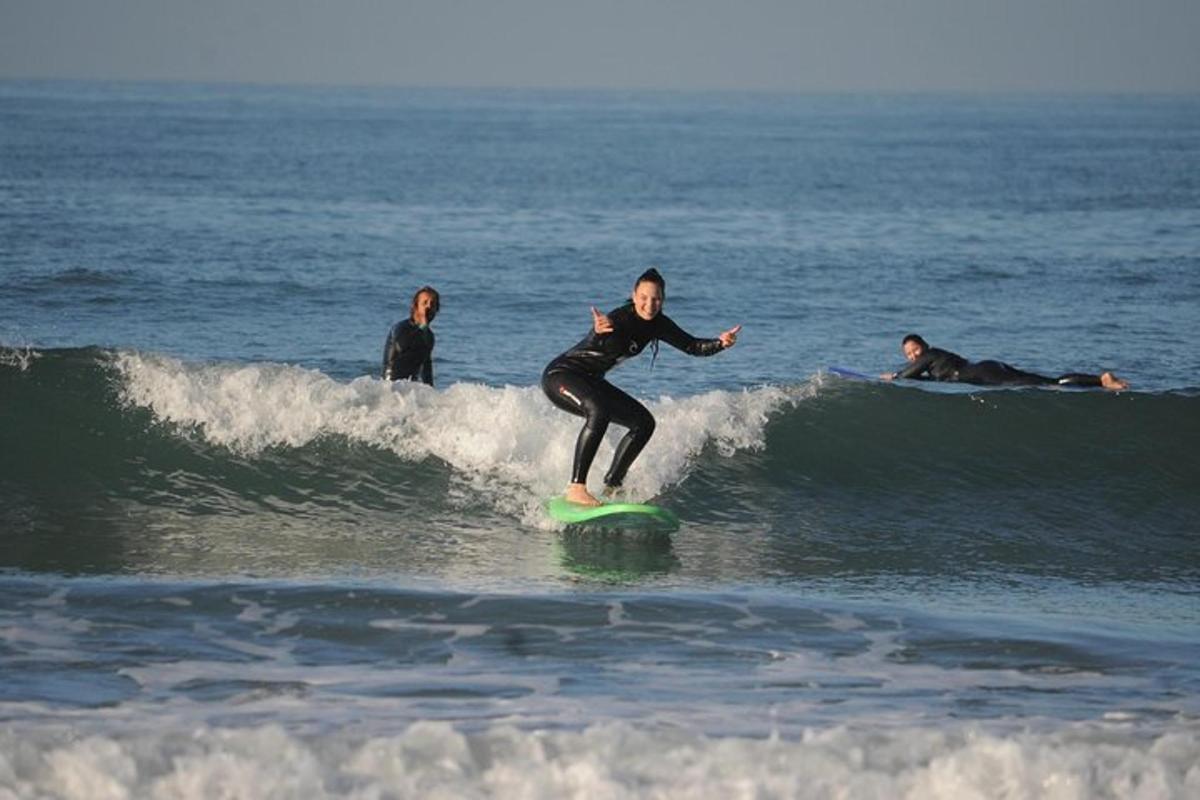 a woman riding a wave on a surfboard in the ocean