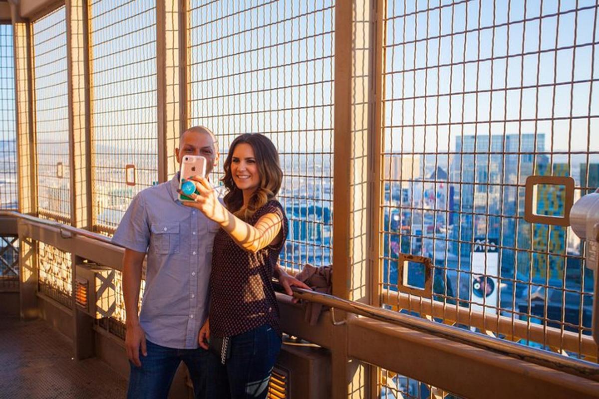 a woman taking a picture of a man taking a picture