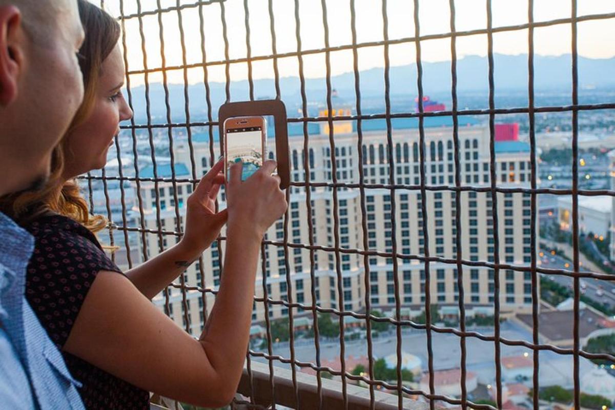 a man and a woman taking a picture of a building